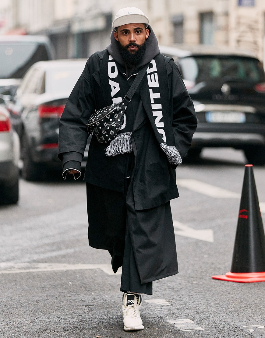 A picture of a street styler wearing a bum bag.