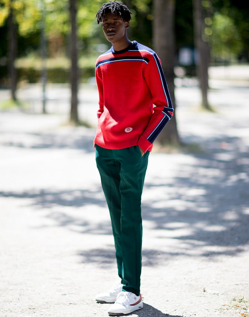 A picture of a street styler wearing a lightweight jumper.