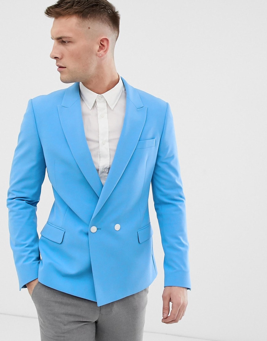 A picture of a model wearing a skinny fit blue blazer. Available at ASOS.
