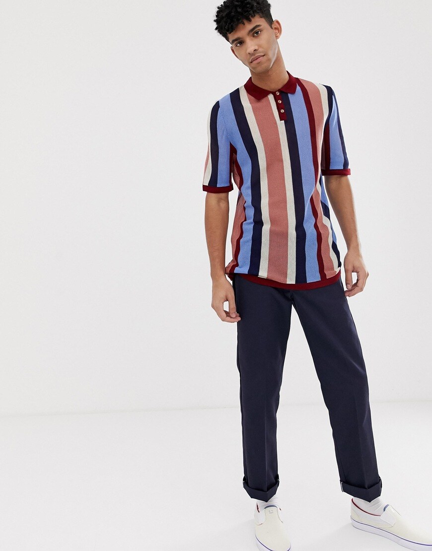 A picture of a model wearing a stripy polo shirt. Available at ASOS.