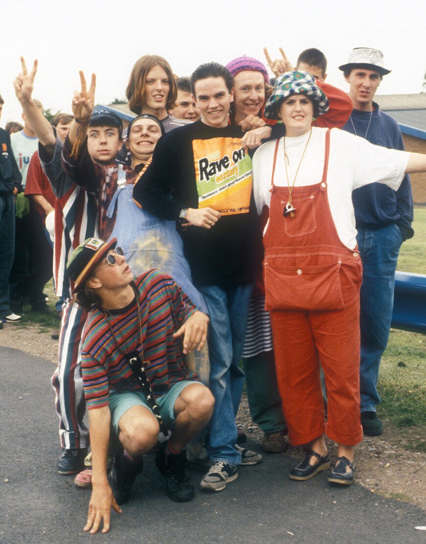 A picture of a group of friends attending a rave in the 90s.