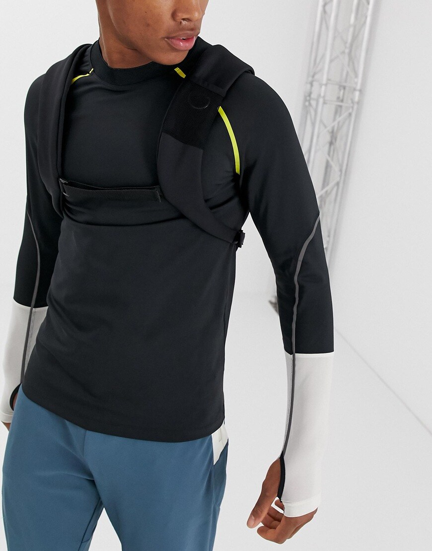 A picture of a model wearing a long-sleeve running top by ASOS 4505. 