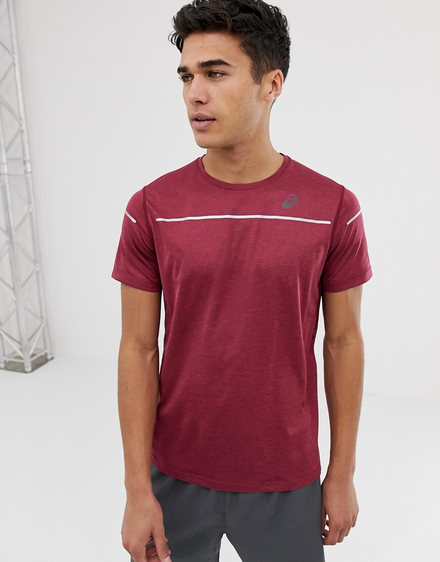 A picture of a model wearing a running T-shirt by Asics, available at ASOS.