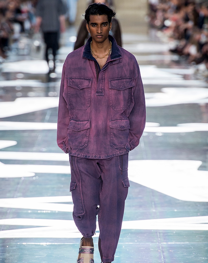 A picture of a runway model wearing washed purple.
