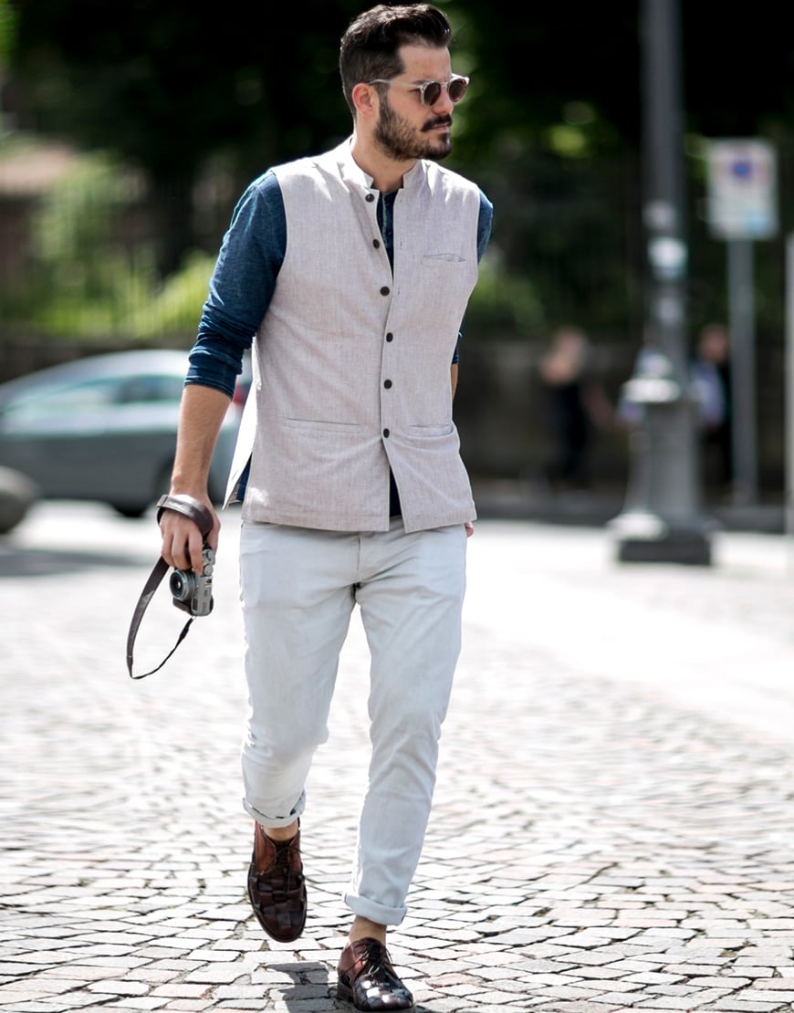 A picture of a street styler wearing a waistcoat and chinos.