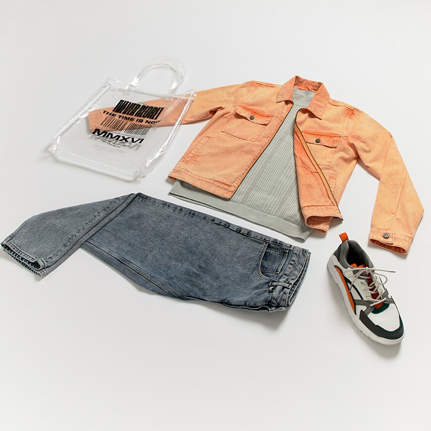 A flat lay outfit featuring a washed-denim jacket and jeans, chunky trainers and accessories. Available at ASOS.