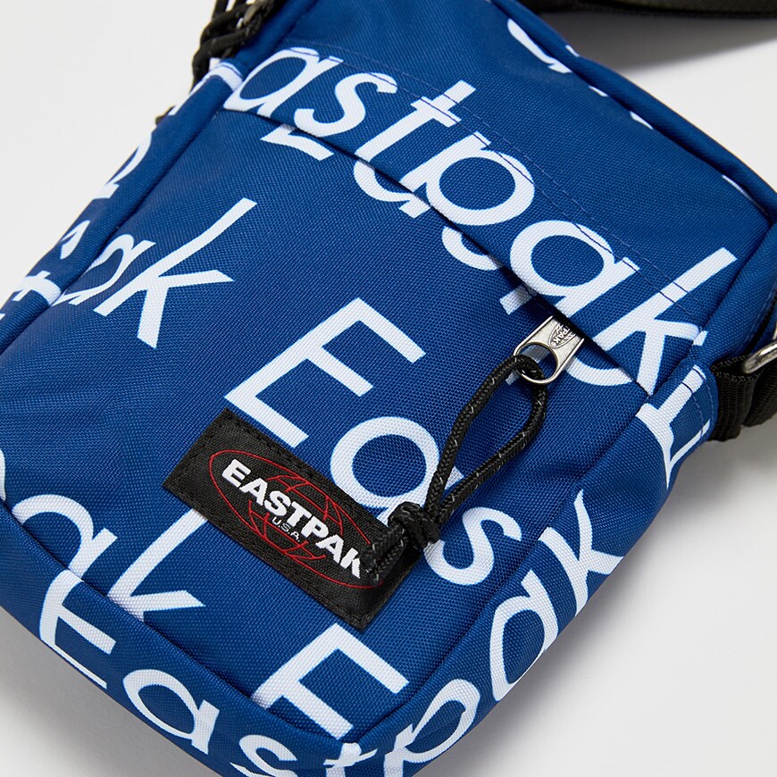 A picture of an Eastpak bag featuring an all-over logo print. Available at ASOS.