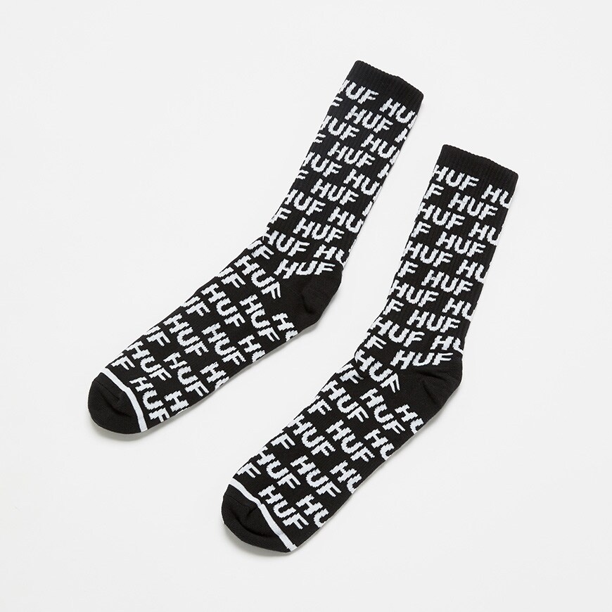 A picture of a pair of HUF socks featuring and all-over logo print. Available at ASOS.