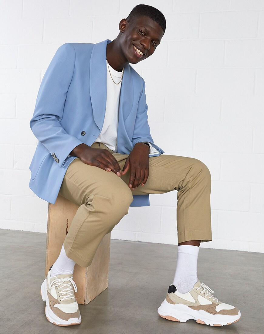 A picture of a model wearing a pastel-blue blazer. Available at ASOS.
