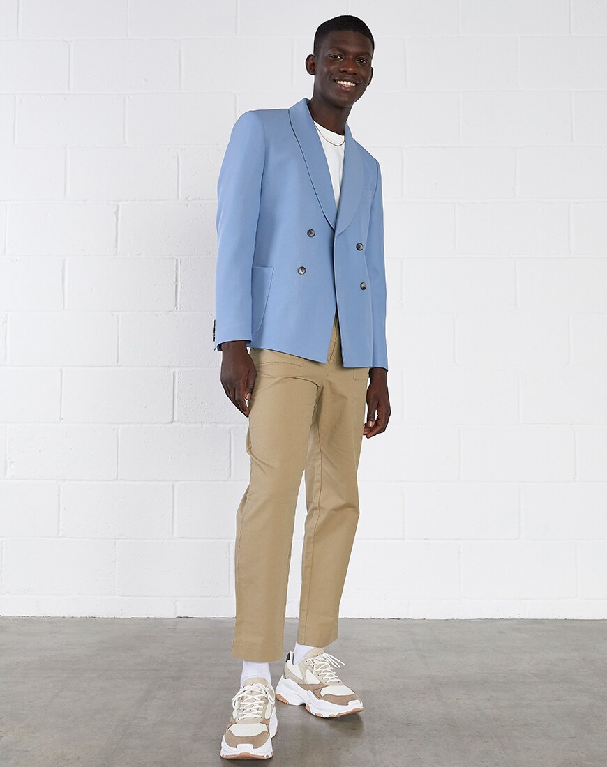 A picture of a model wearing a pastel-blue blazer. Available at ASOS.