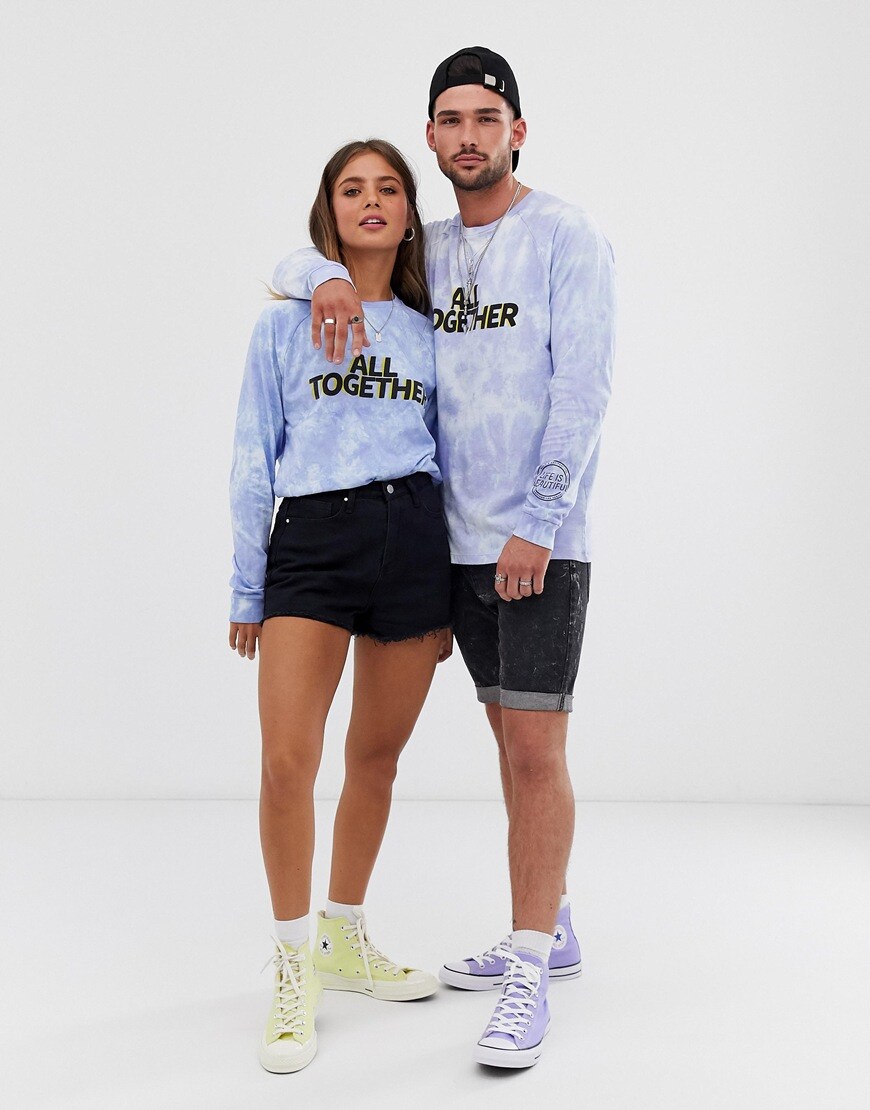 A picture of a male and female model wearing a blue unisex tie-dye T-shirt. Available at ASOS.