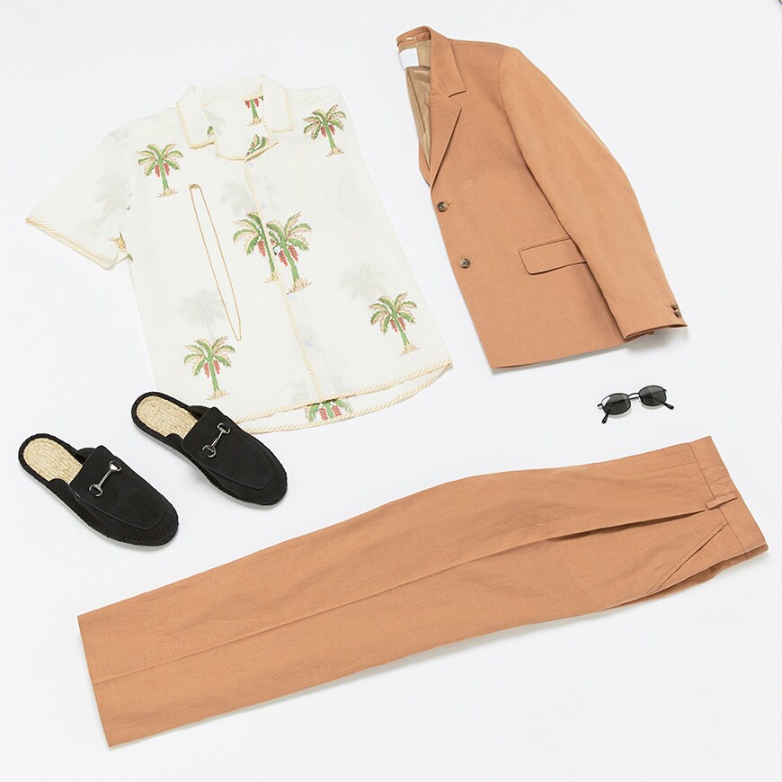A flat lay picture of a suit, shirt, loafers and accessories. Available at ASOS.