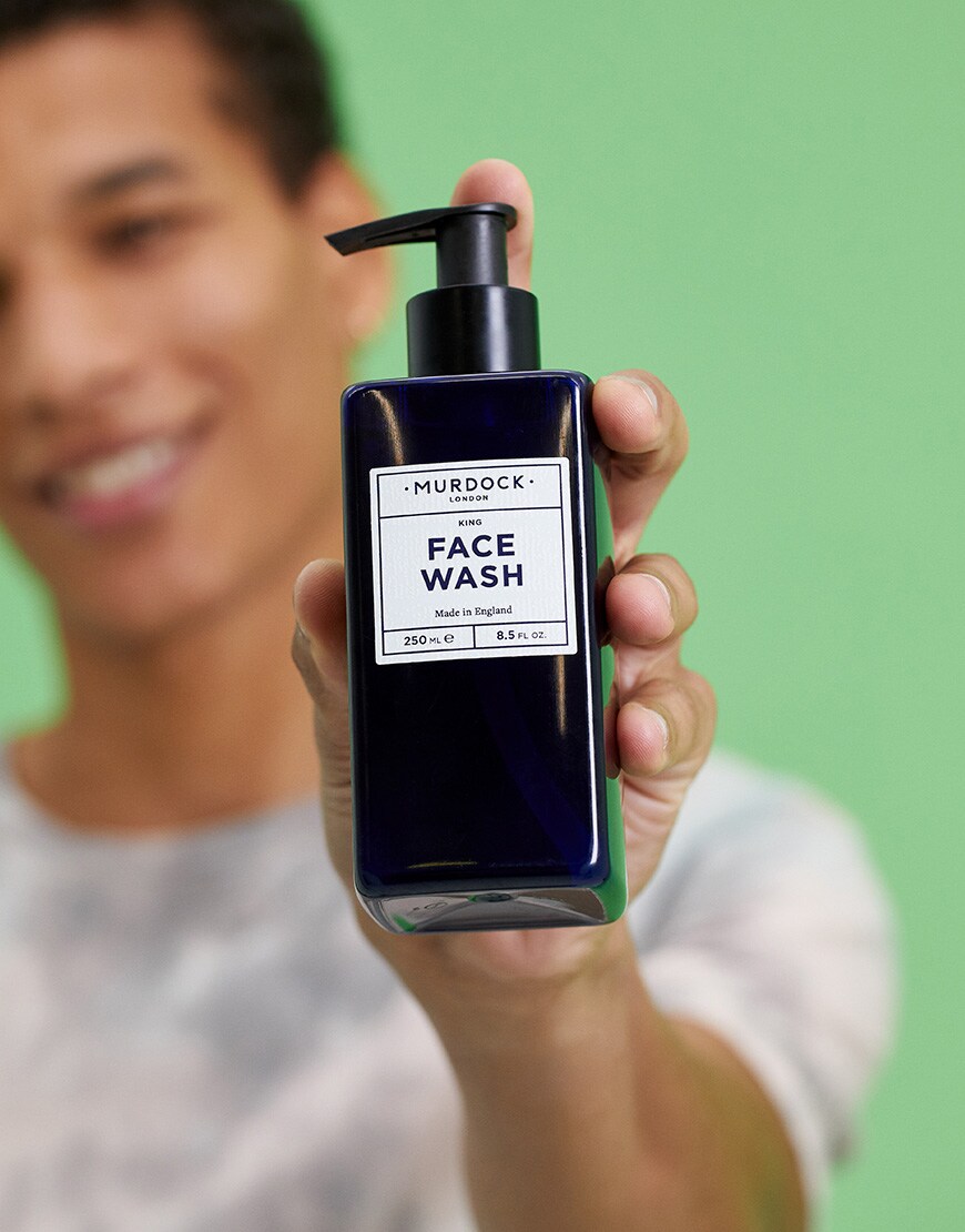 A picture of a model holding face wash by Murdock London. Available at ASOS.