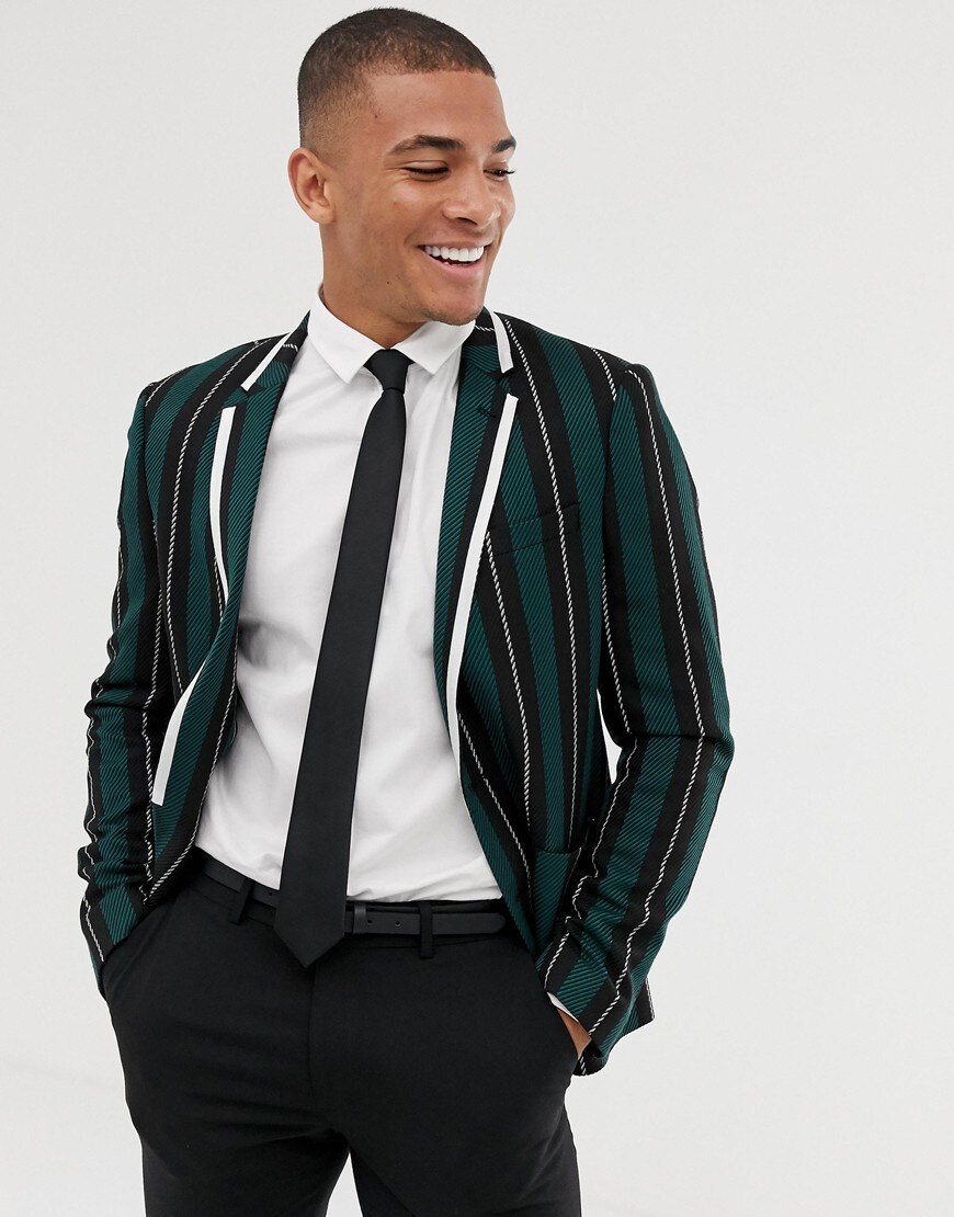A picture of a model wearing a striped blazer, white shirt and black trousers. Available at ASOS.