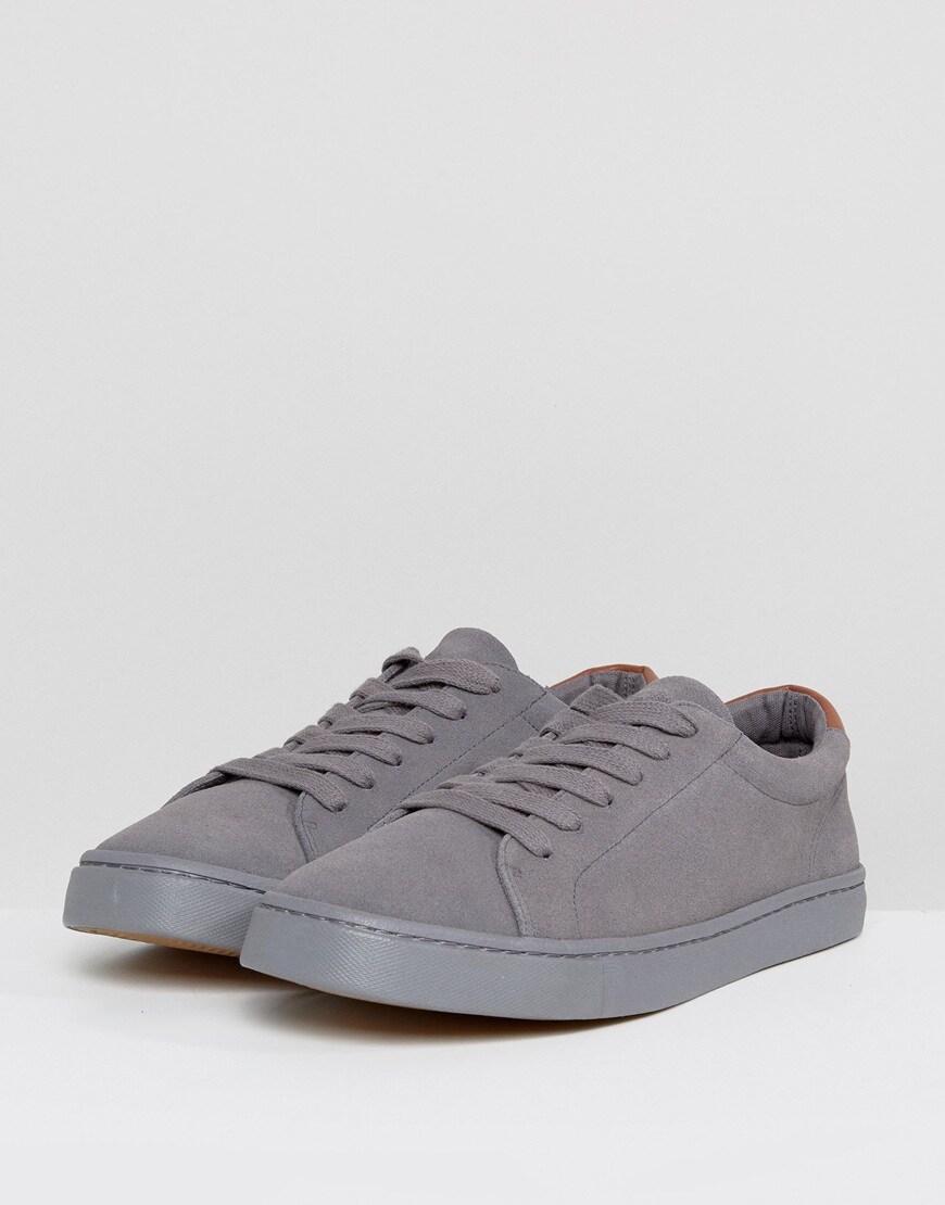 A picture of a pair of grey suede trainers. Available at ASOS.