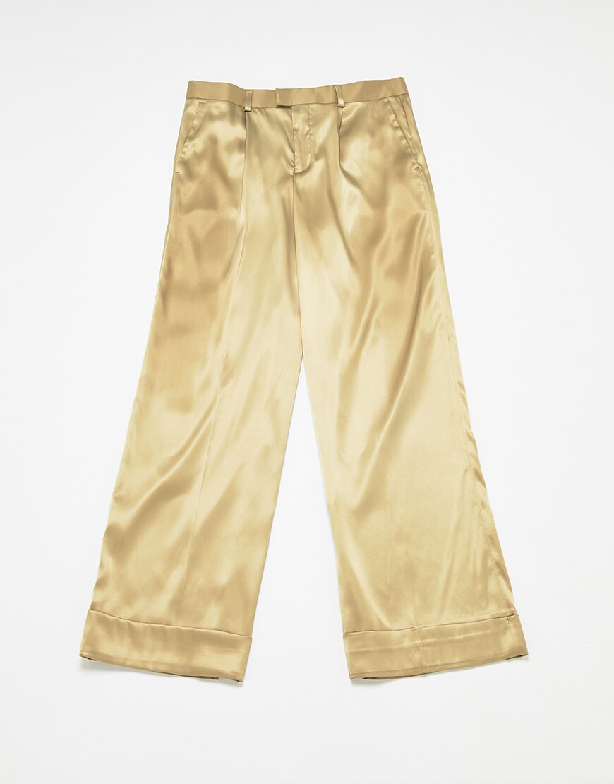 A picture of a pair of gold-tone, satin-style trousers. Available at ASOS.