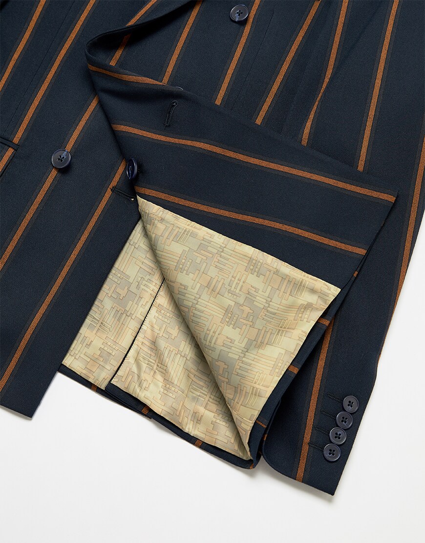 A picture of a navy and orange striped blazer. Available at ASOS.