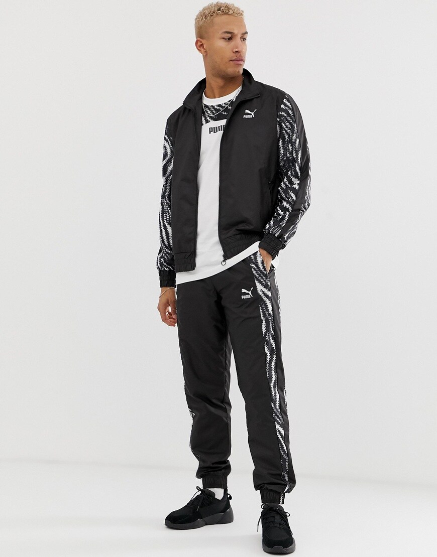 A picture of a model wearing a PUMA tracksuit set with abstract animal print details. Available at ASOS.