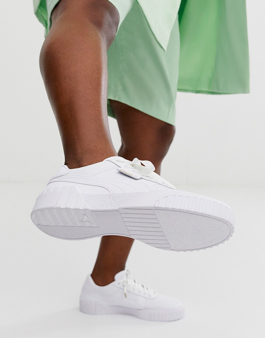 A picture of an ASOSer wearing PUMA Cali trainers. Available at ASOS.