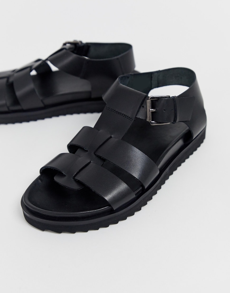 A picture of a pair of black faux-leather sandals. Available at ASOS.
