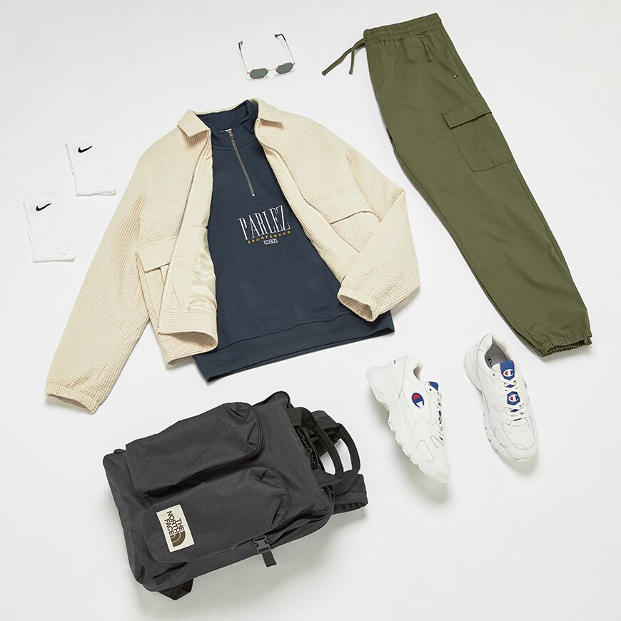 A flat lay outfit of a comfortable airport look. Available at ASOS.
