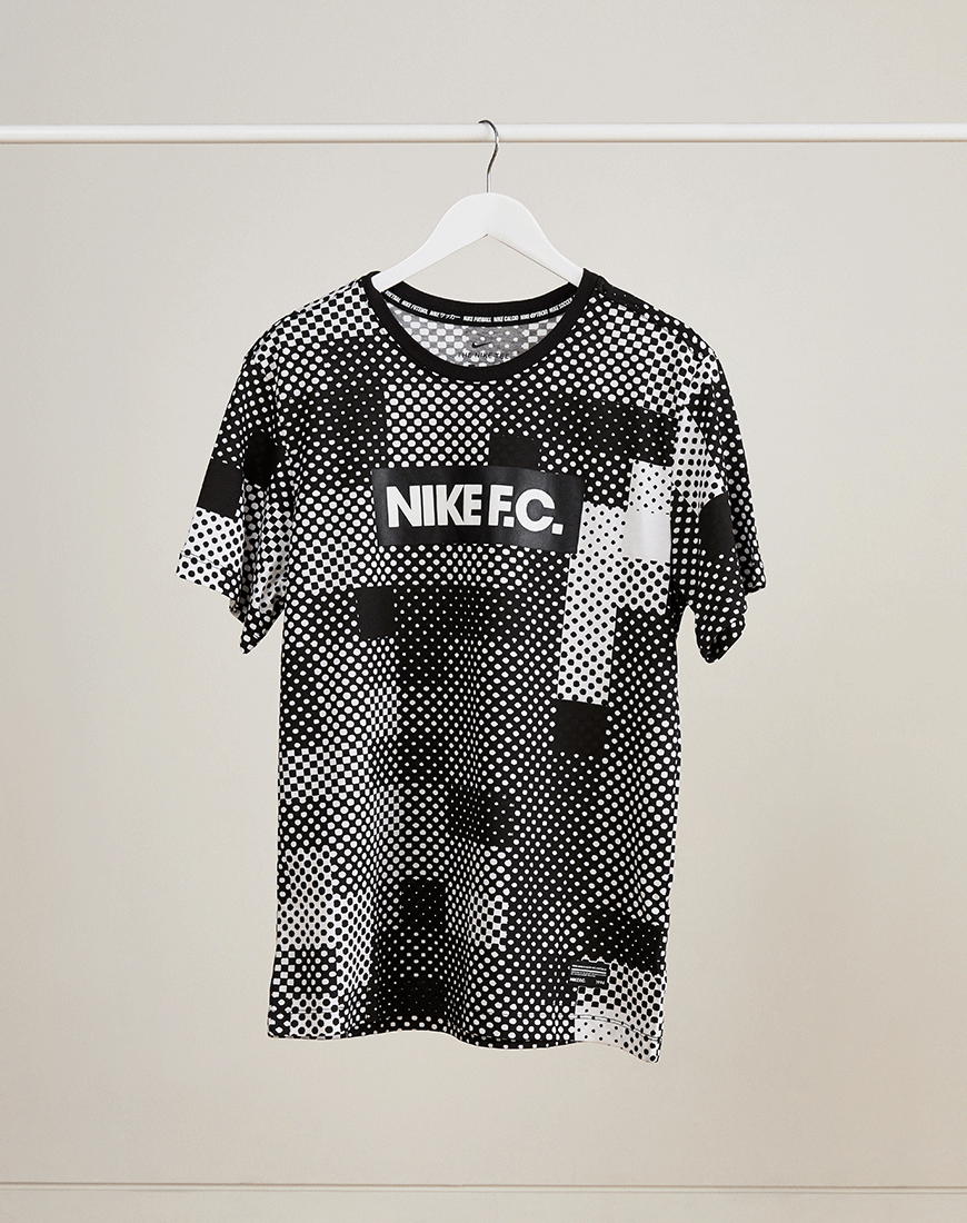 A moving gif of a NIKE F.C. graphic print T-shirt. Available at ASOS.