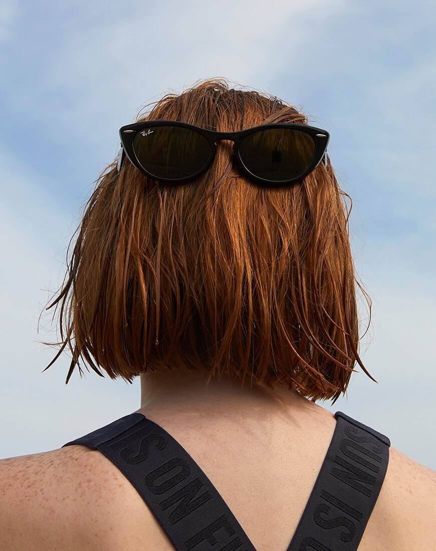 A picture of an ASOS Insider wearing a a pair of Ray-Ban sunglasses. Available at ASOS.