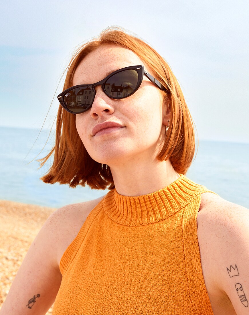 A picture of an ASOS Insider wearing Ray-Ban sunglasses. Available at ASOS.