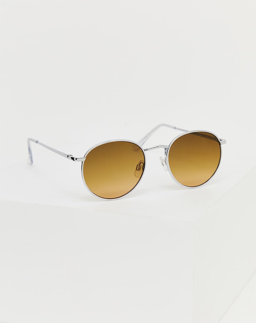 A picture of a pair of silver round lens sunglasses. Available at ASOS