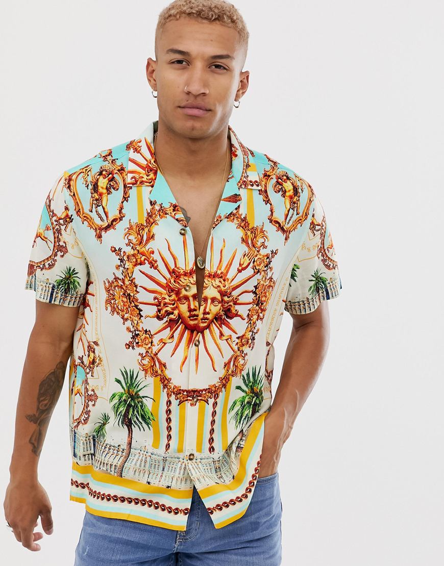 A picture of a model wearing a baroque print shirt by ASOS DESIGN. Available at ASOS.