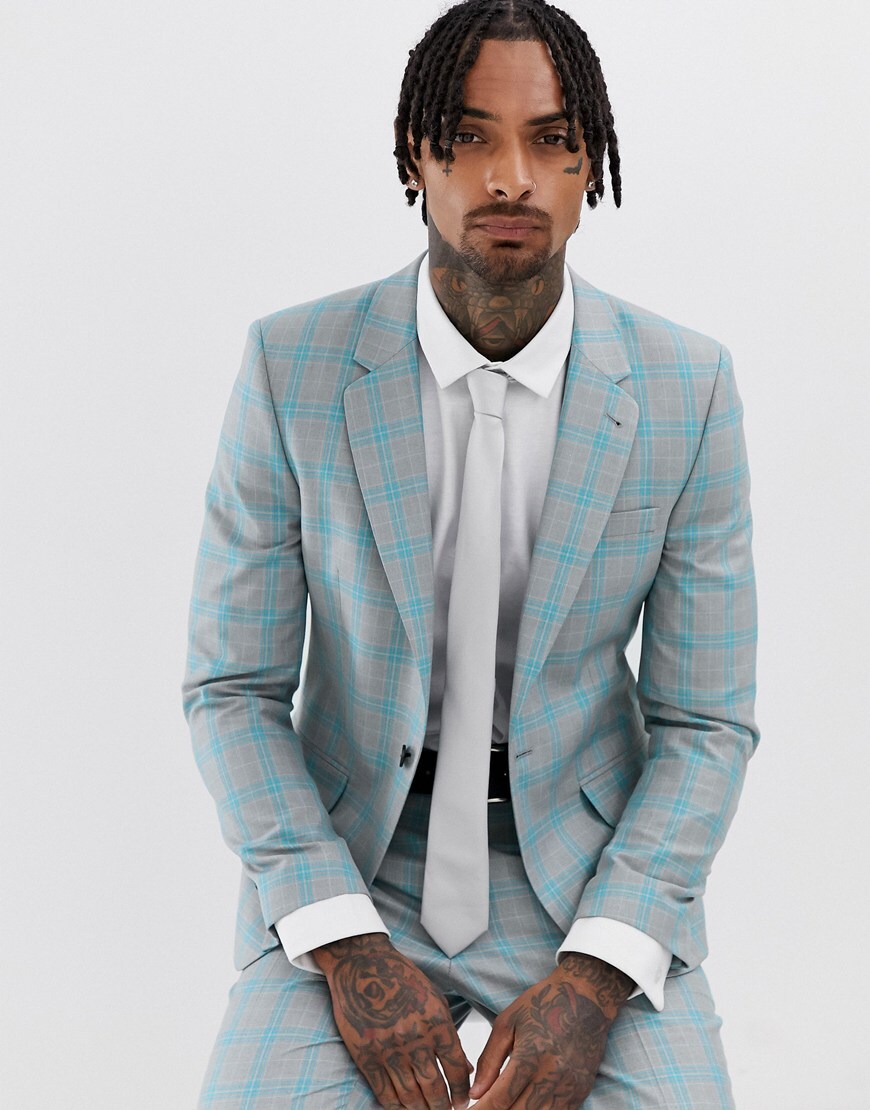 A picture of a model wearing a blue and grey check suit. Available at ASOS.