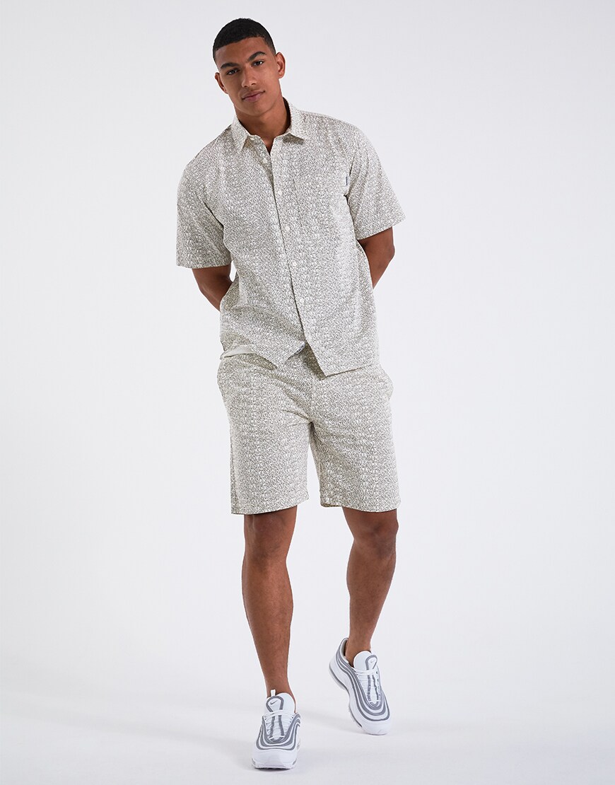 A picture of a model wearing a shirts and shorts co-rd by Carhartt WIP. Available at ASOS.