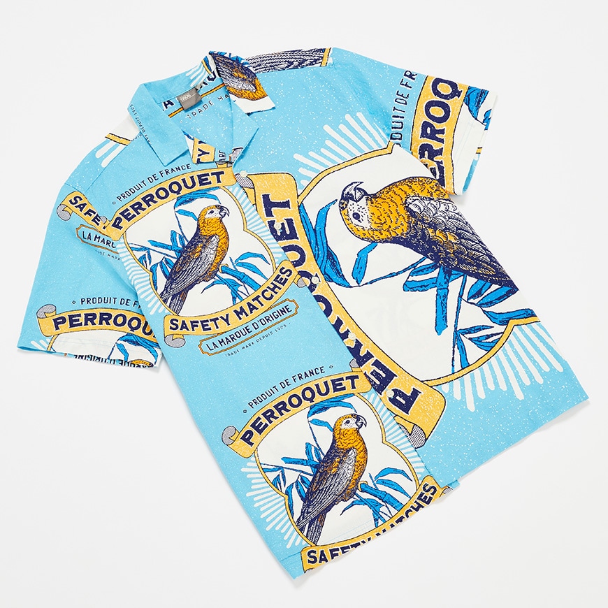 A picture of a blue revere-collar shirt with an oversized parrot print. Available at ASOS.