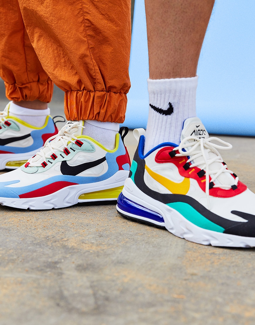 A picture of two models wearing the new Nike Air Max 270 React Bauhaus trainers. Available at ASOS.