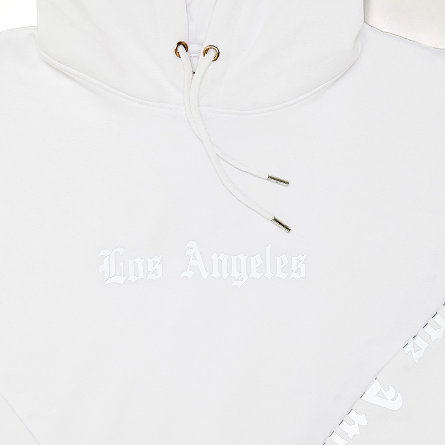 A picture of a white hoodie featuring reflective text on the chest and sleeves. Available at ASOS.