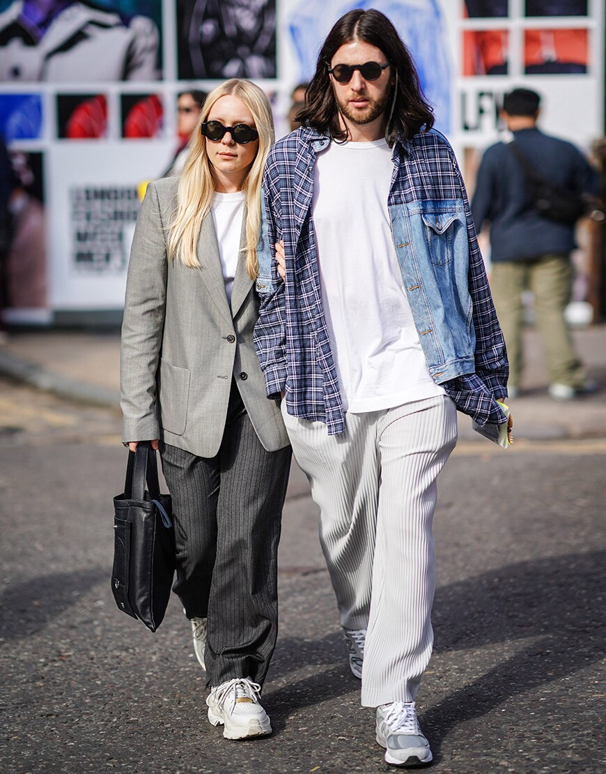 A picture of an street styler wearing a check-and-denim patchwork jacket.