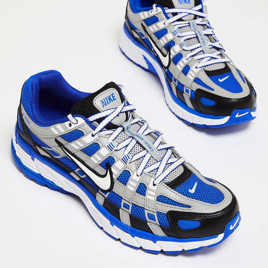 A picture of the Nike P600 trainers in a blue and silver colourway. Available at ASOS.