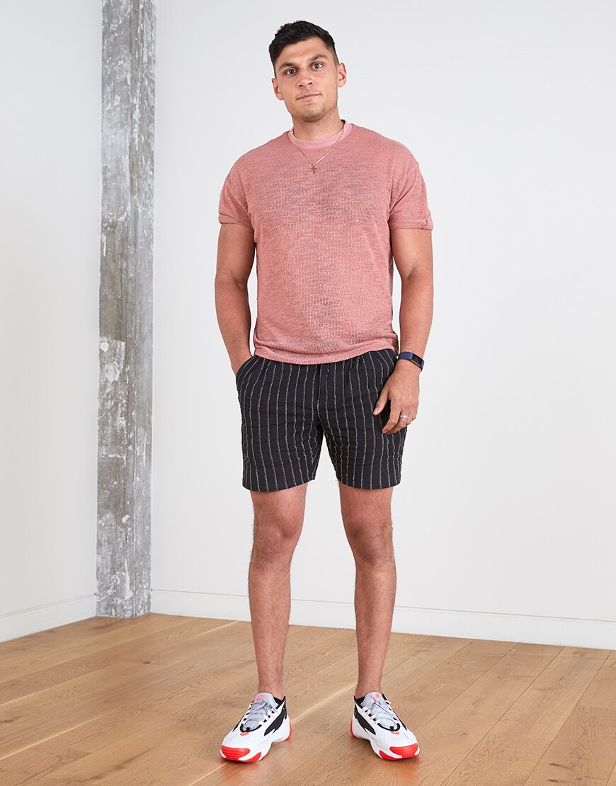 A picture of an ASOSer wearing a red T-shirt, striped shorts and Nike Zoom Tekno trainers. Available at ASOS.