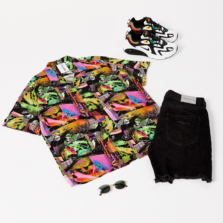 A flay-lay outfit including a brightly coloured shirt, black denim shorts, Nike trainers and sunglasses. Available at ASOS.