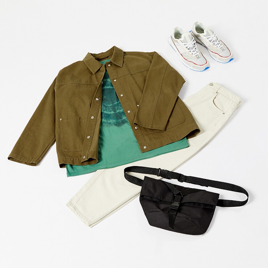 A flat-lay image of a khaki overshirt, a tie-dye T-shirt, white jeans and New Balance trainers. Available at ASOS.