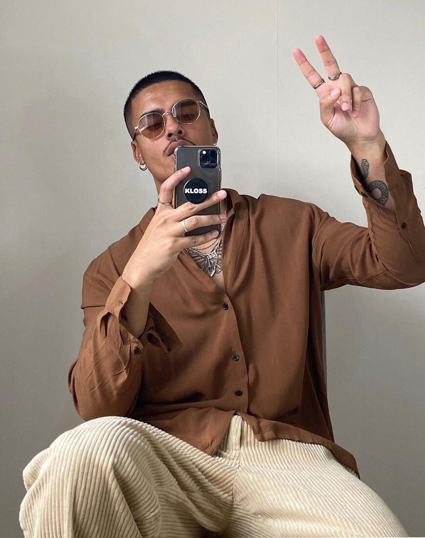 @supremetosociety wearing brown shirt and cords look