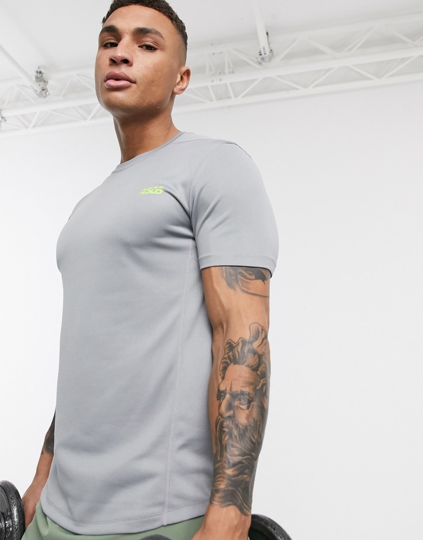 A picture of a man wearing a grey ASOS 4505 T-shirt.