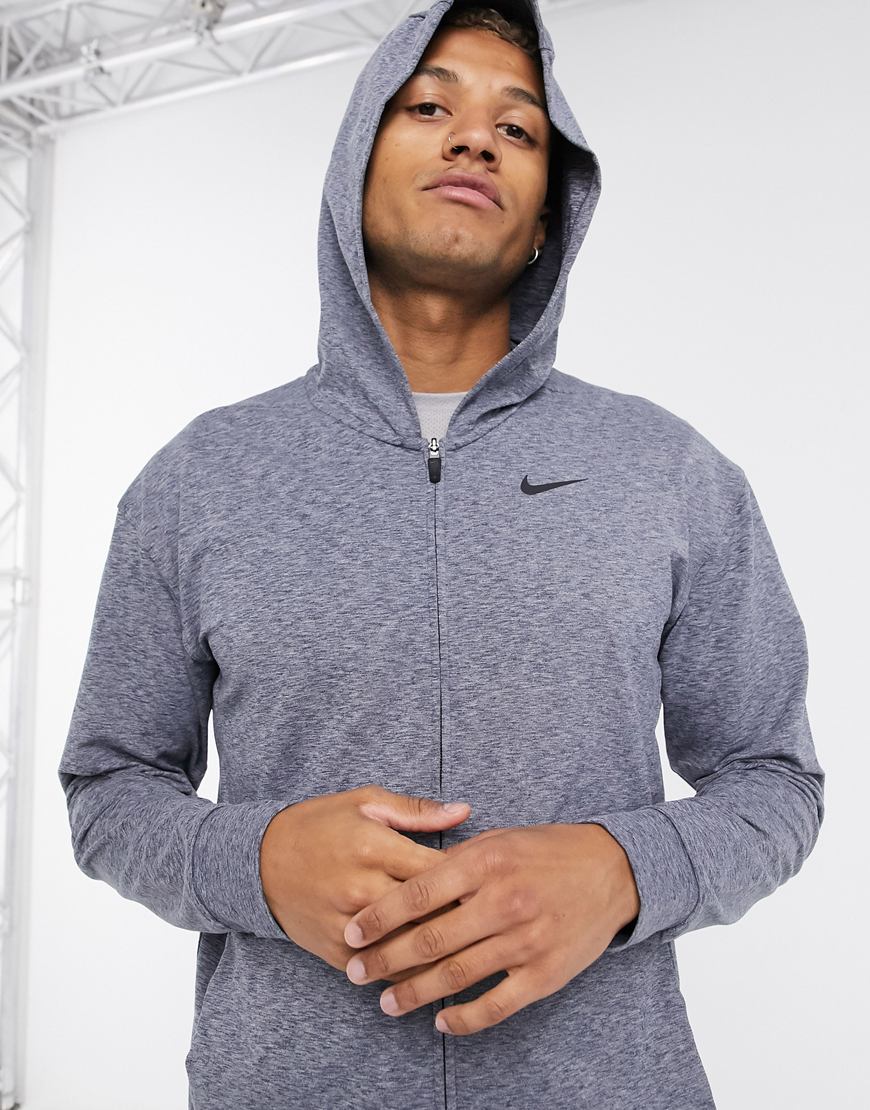 A picture of a model wearing a lightweight hoodie by Nike