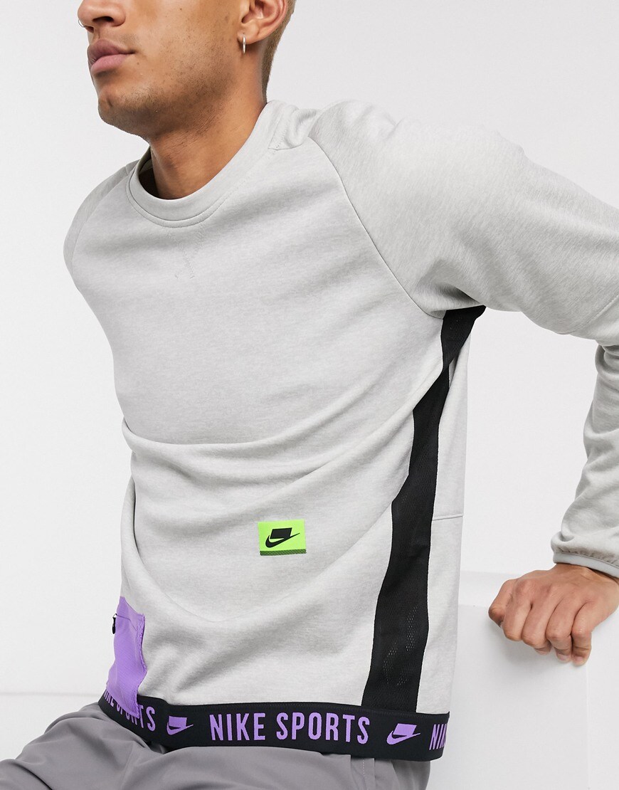 A picture of a model wearing a Nike Training sweatshirt