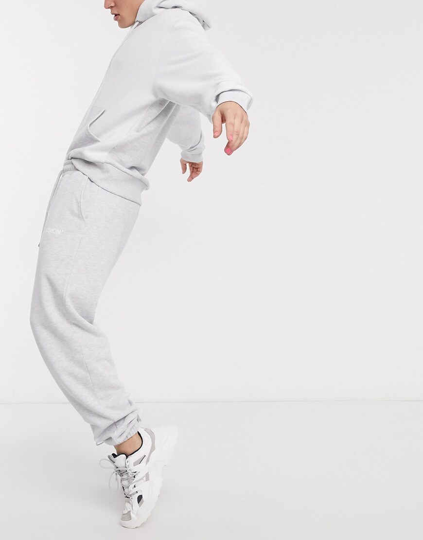 A picture of a model wearing a marl hoodie and joggers by COLLUSION. Available at ASOS.