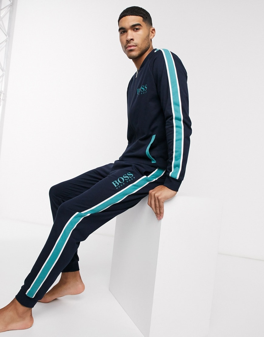A picture of a model wearing a T-shirt and joggers lounge set by BOSS by Hugo Boss. Available at ASOS.