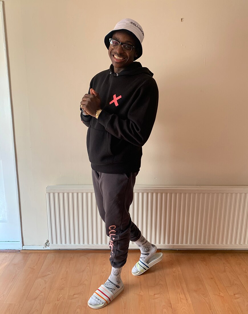 A picture of a man wearing a hoodie, bucket hat and joggers by COLLUSION. Available at ASOS.