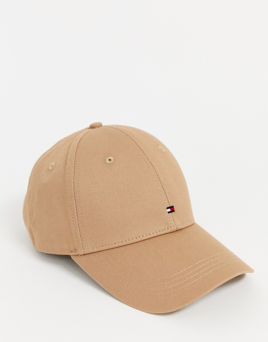 A picture of a tan-coloured cap by Tommy hilfiger featuring the brand's flag logo as a small embroidered detail to the front. Part of the ASOS Responsible Edit, available now.