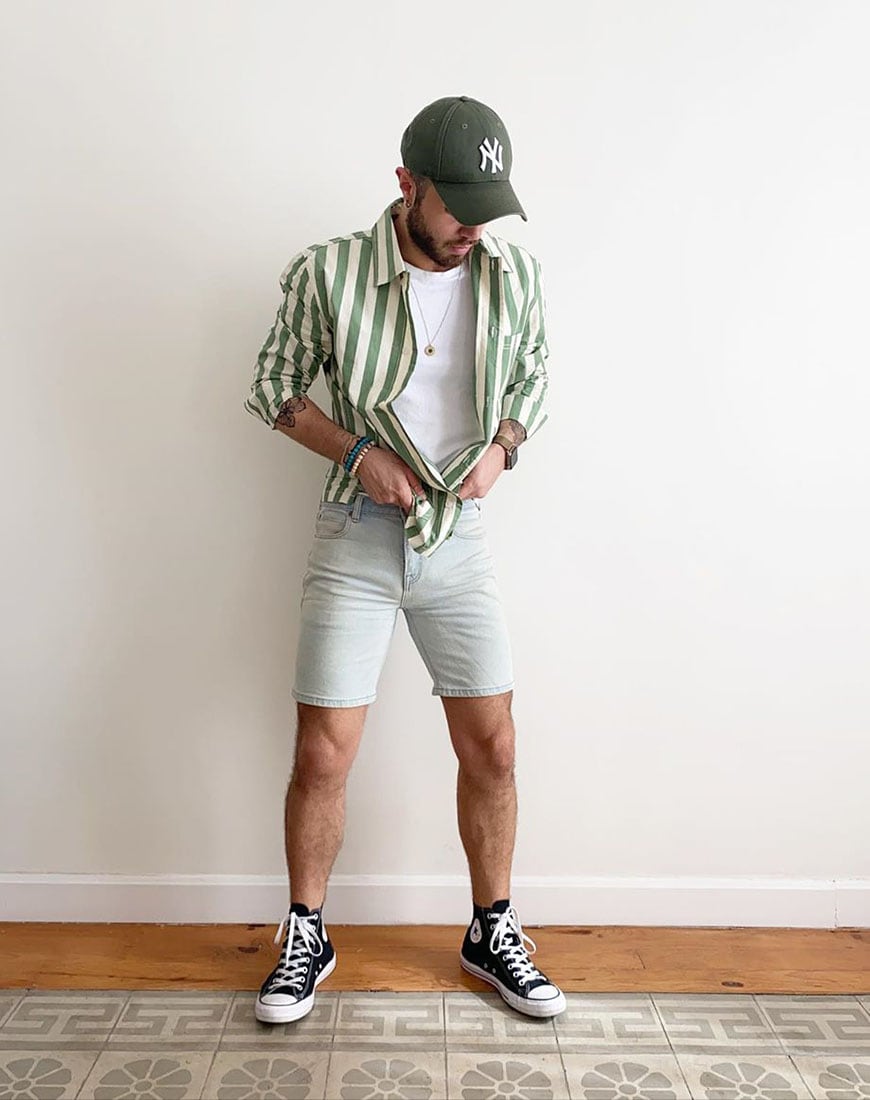 A picture of ASOS Insider ASOS Thomas wearing a green striped shirt, denim shorts, white T-shirt and high-top Converse. Available at ASOS.