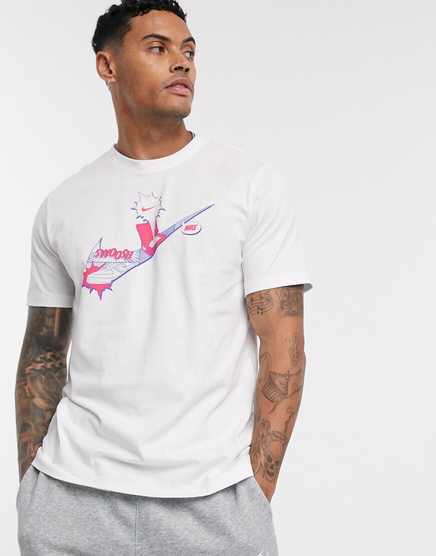 A picture of a model wearing a graphic-print T-shirt by Nike. Available at ASOS.